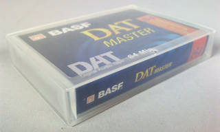Digital audio tape in inert plastic media container