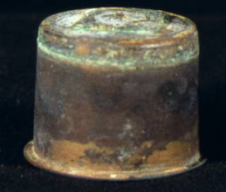 Brass inkwell with corrosion