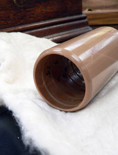 Brown wax cylinders with surface damage