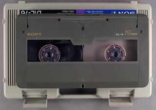 D-1 cassette pictured with carrying case