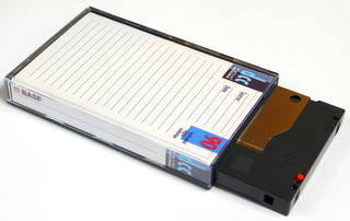 digital compact cassette partially in slip case