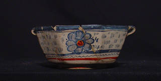 Earthenware bowl, with signs of impact damage