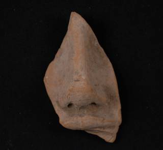 Earthenware figurine fragment