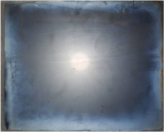 Light reflected off dull emulsion side 