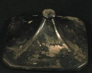 Silver artifact with heavy tarnish