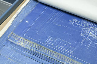 Blueprints on drafting cloth exhibiting frayed edges